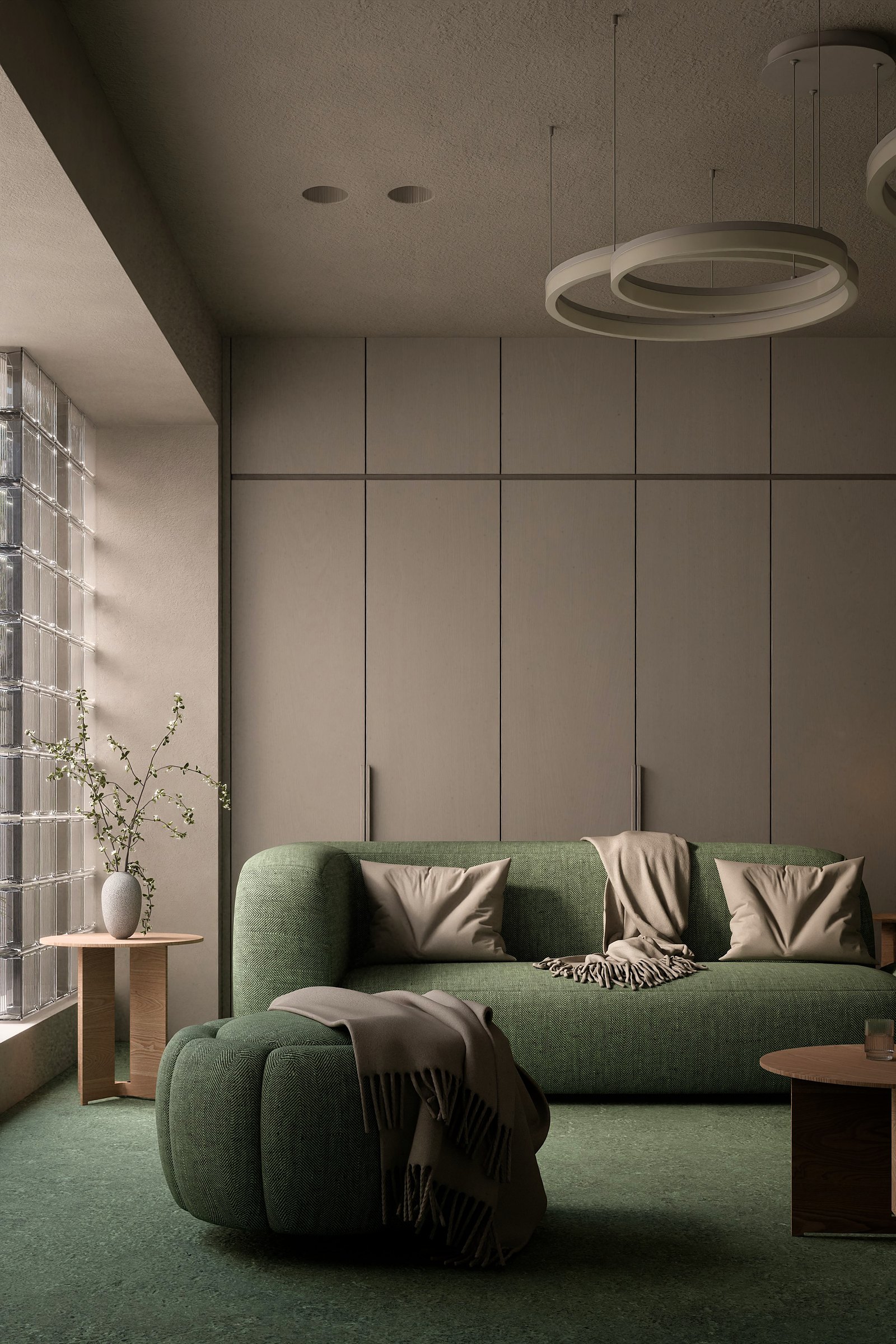 Green Room, view 1: Green upholstery, ring lamps and a glass-block window.
